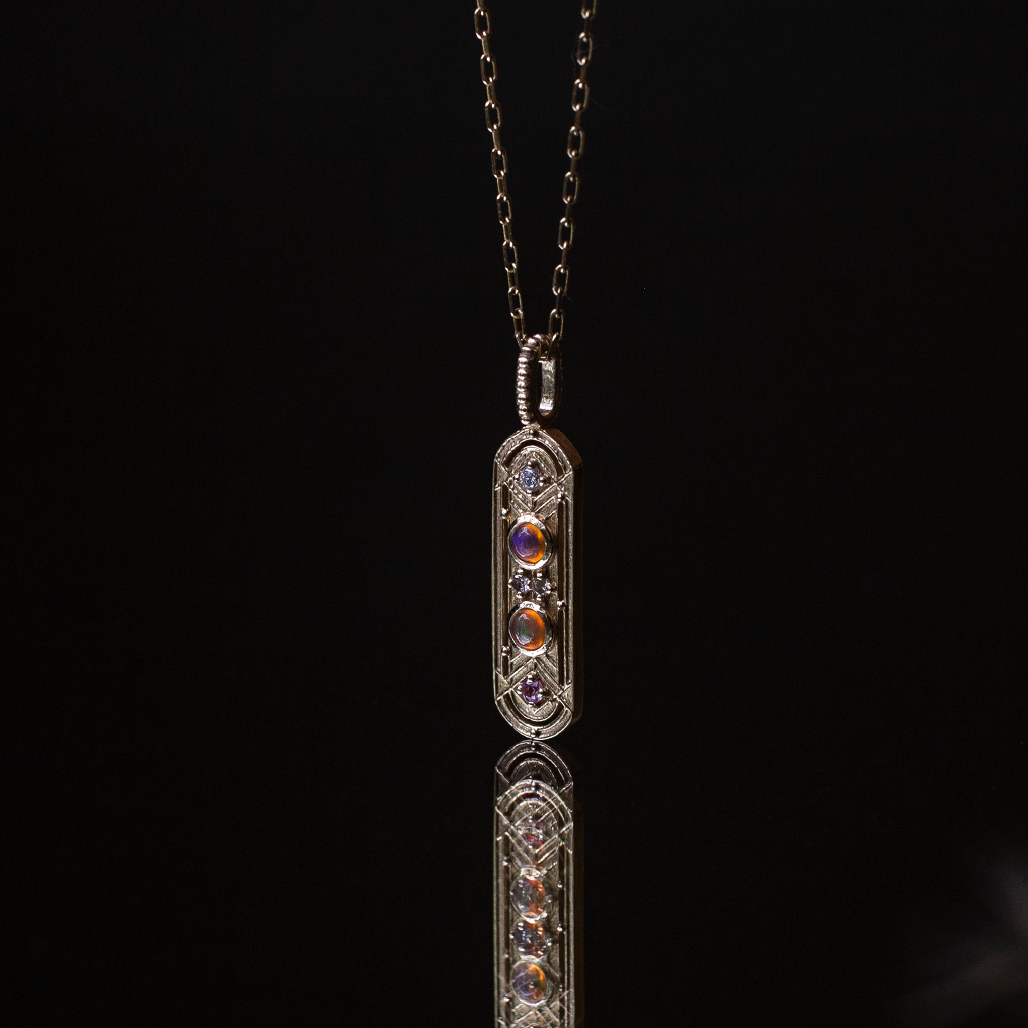 opal and sapphire gold charm