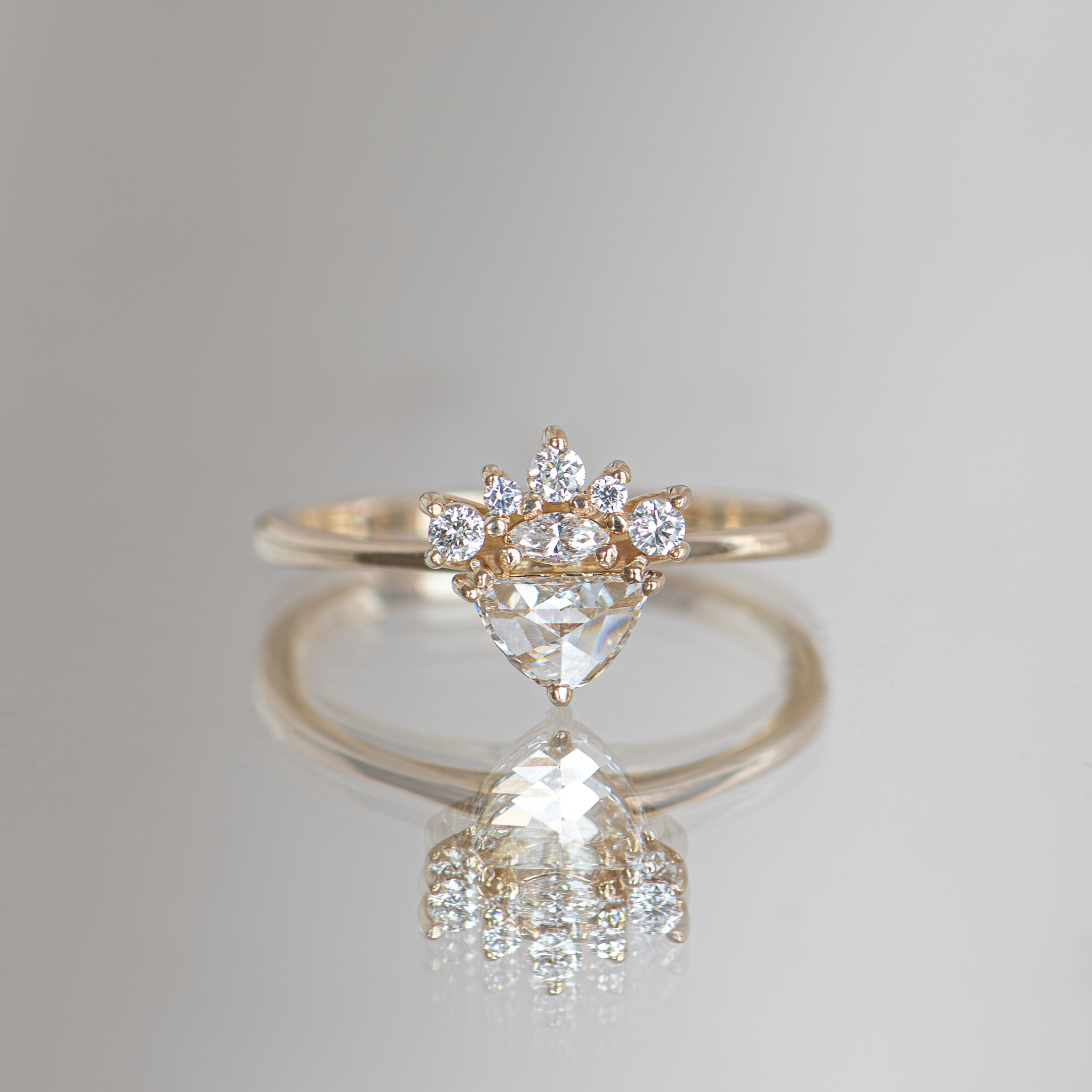 Half moon diamond engagement ring.