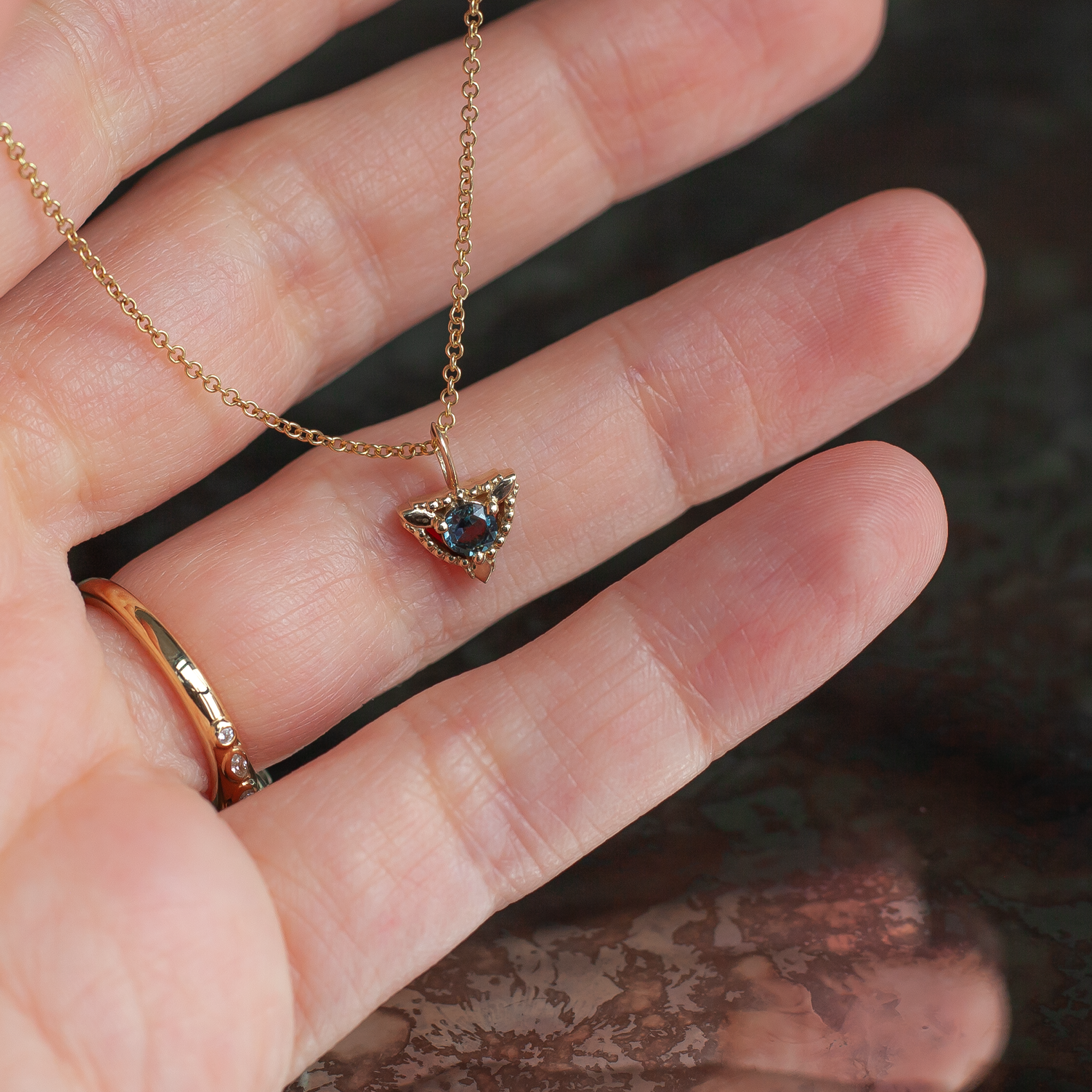 Sapphire trillium gold charm