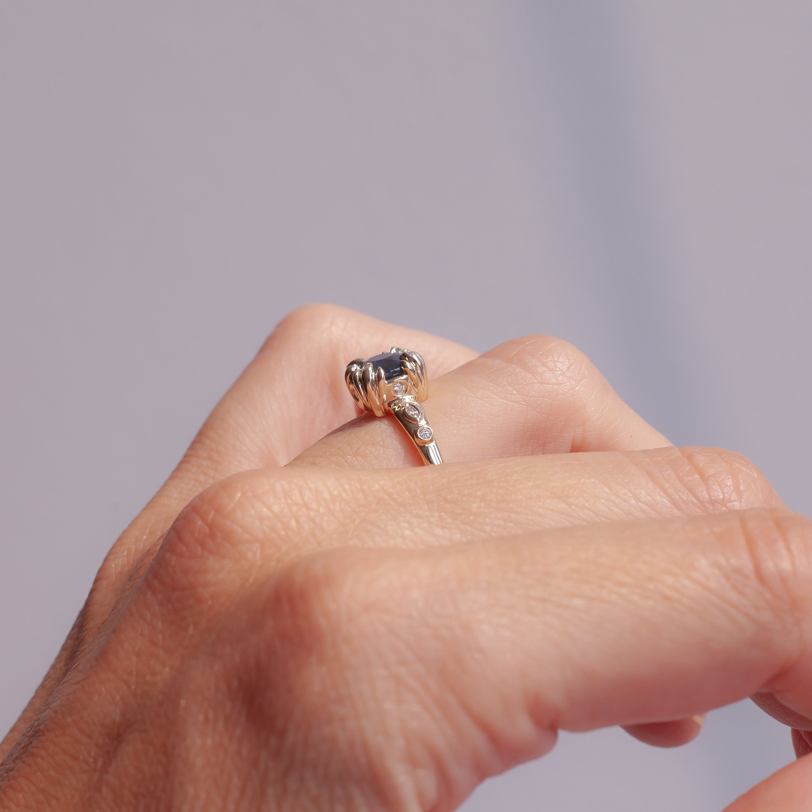 Teal sapphire with diamonds ring