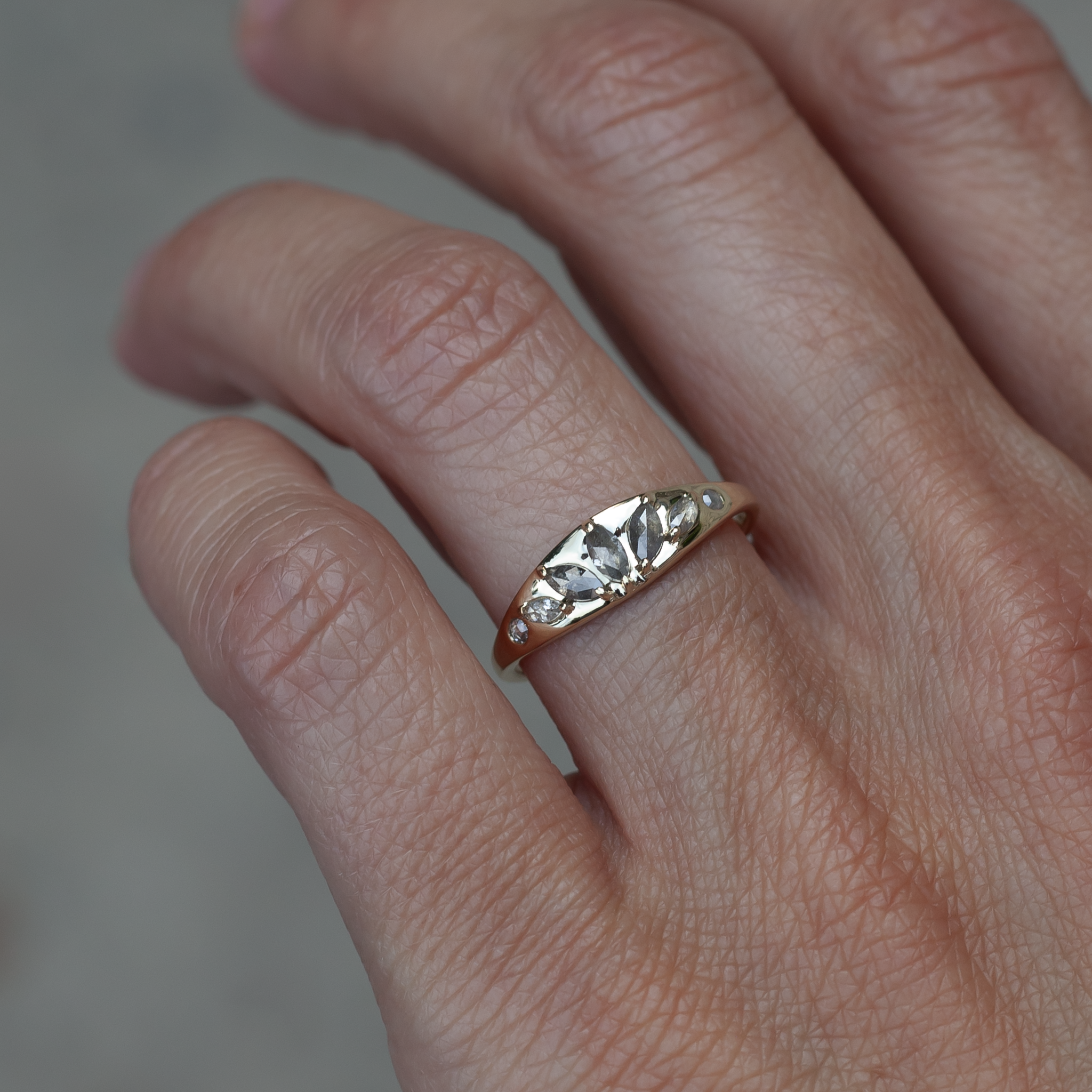 Gold signet ring with diamonds.