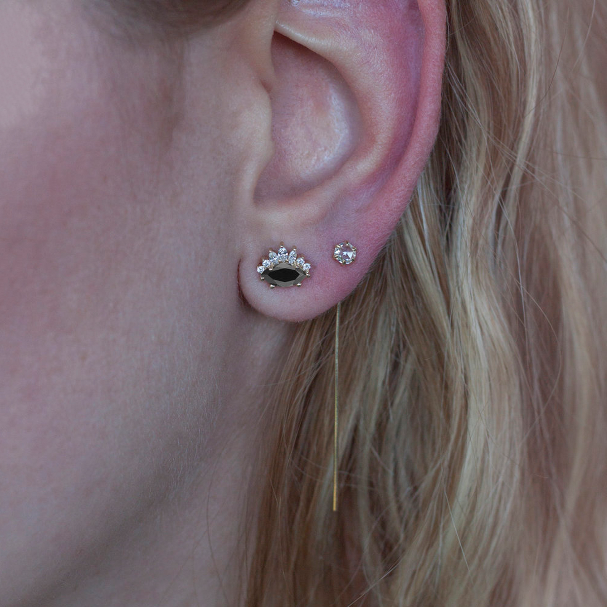 Black diamond evil eye earrings.