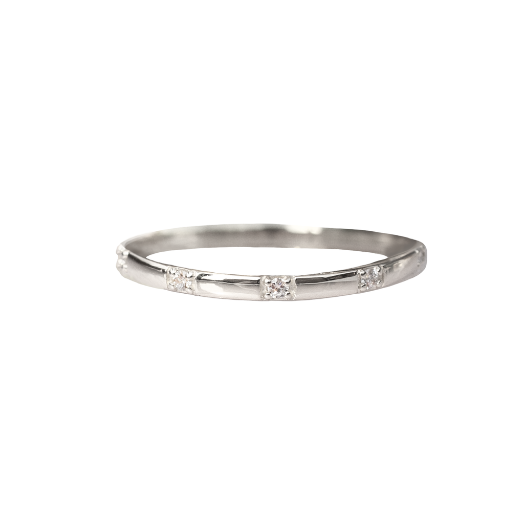 Straight delicate diamond wedding band, 14k or 18k white gold. Meant to be stacked, or worn as an everyday staple.