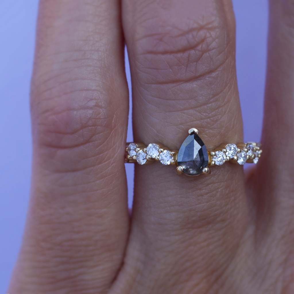 Unique salt and pepper rose cut pear diamond engagement ring, on a diamond cluster band, prong setting, made in 14k or 18k yellow gold. 