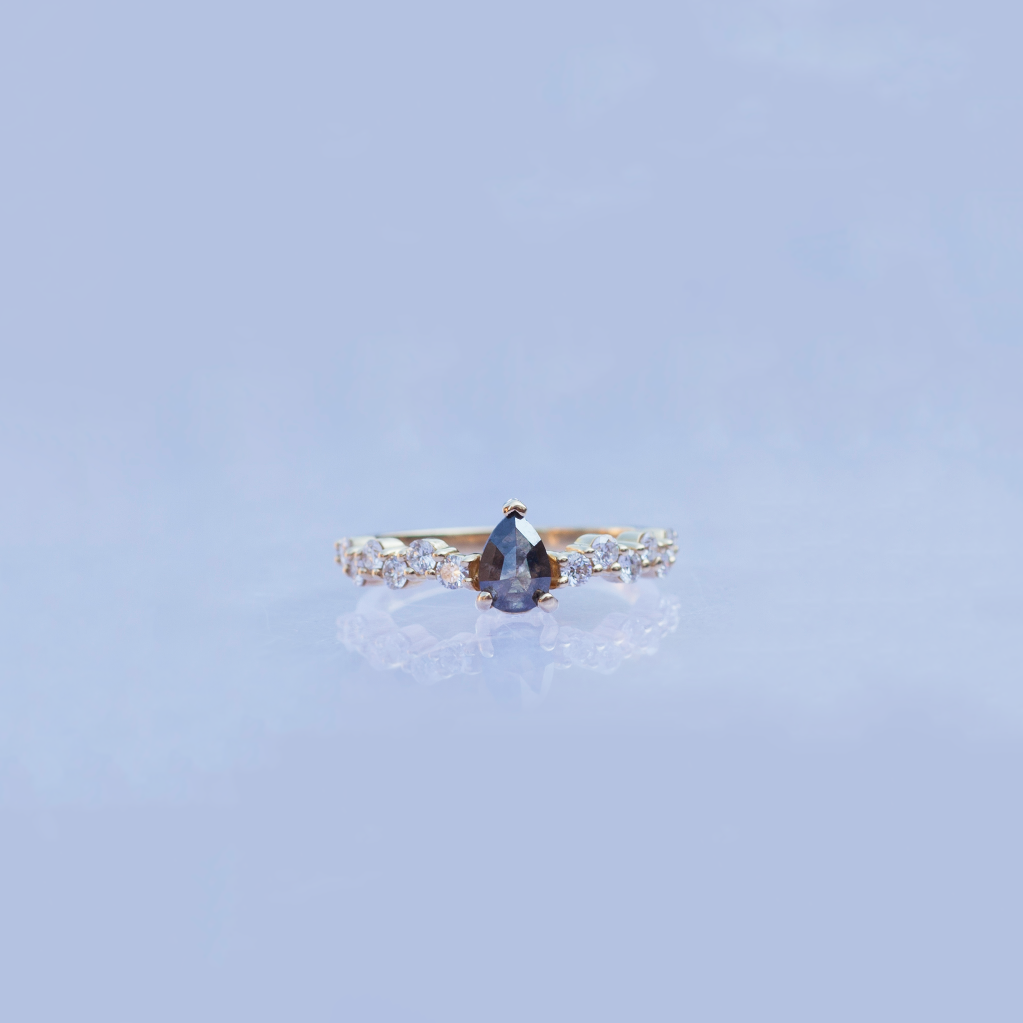 Unique salt and pepper rose cut pear diamond engagement ring, on a diamond cluster band, prong setting, made in 14k or 18k yellow gold.