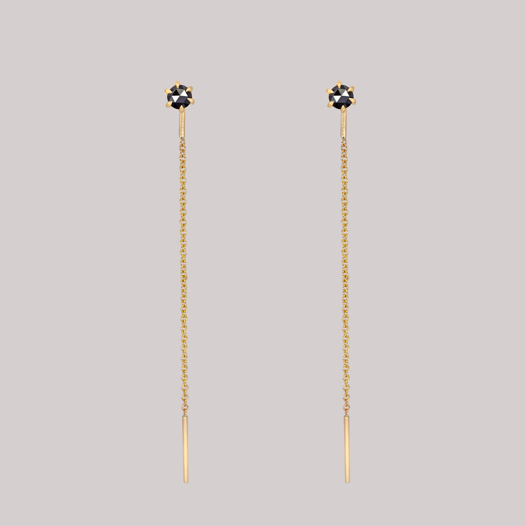 Delicate black round rose cut diamond threaders, ideal for threading through multiple piercings, feature a six claw prong setting, using 14k or 18k gold.