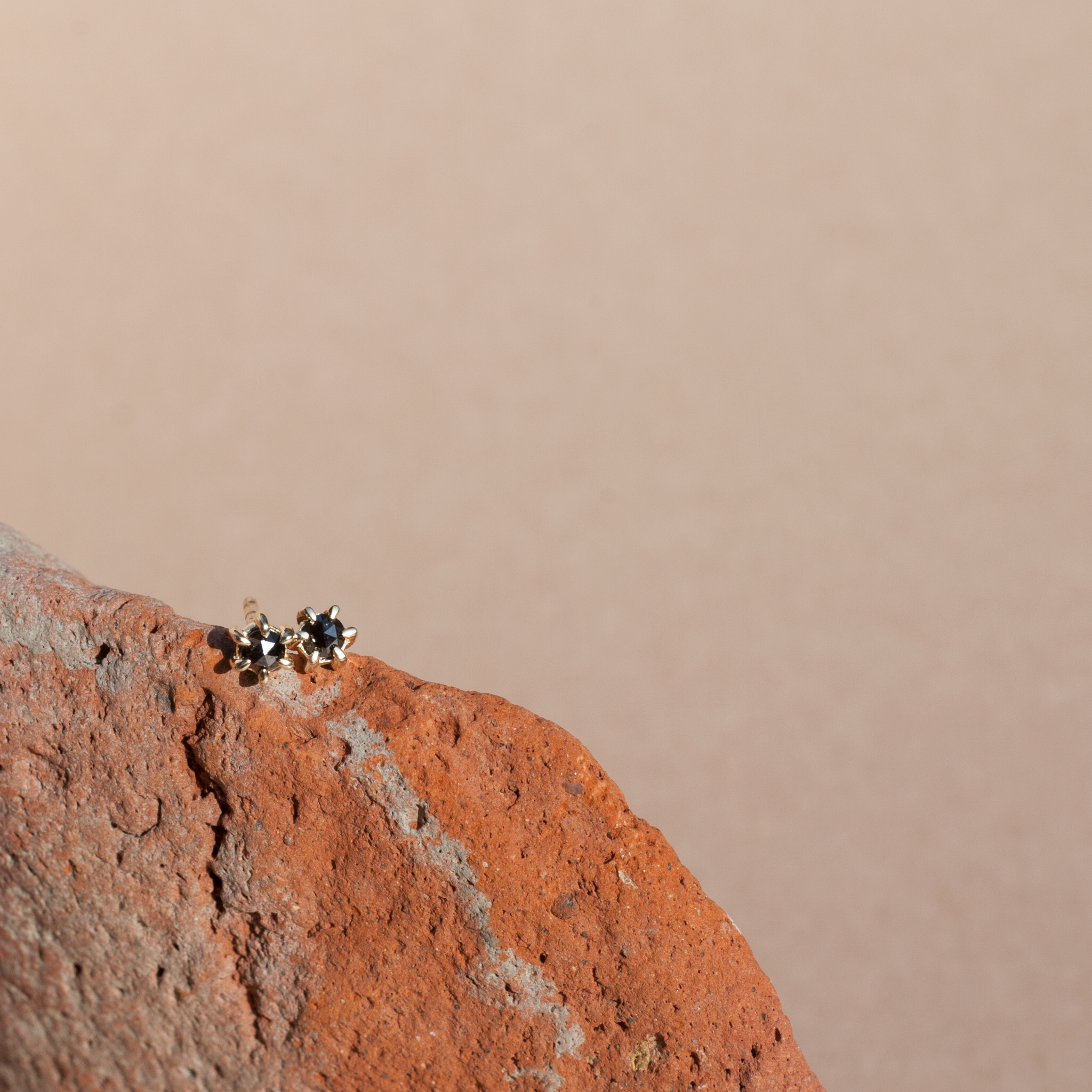 Black diamond stud earrings yellow gold