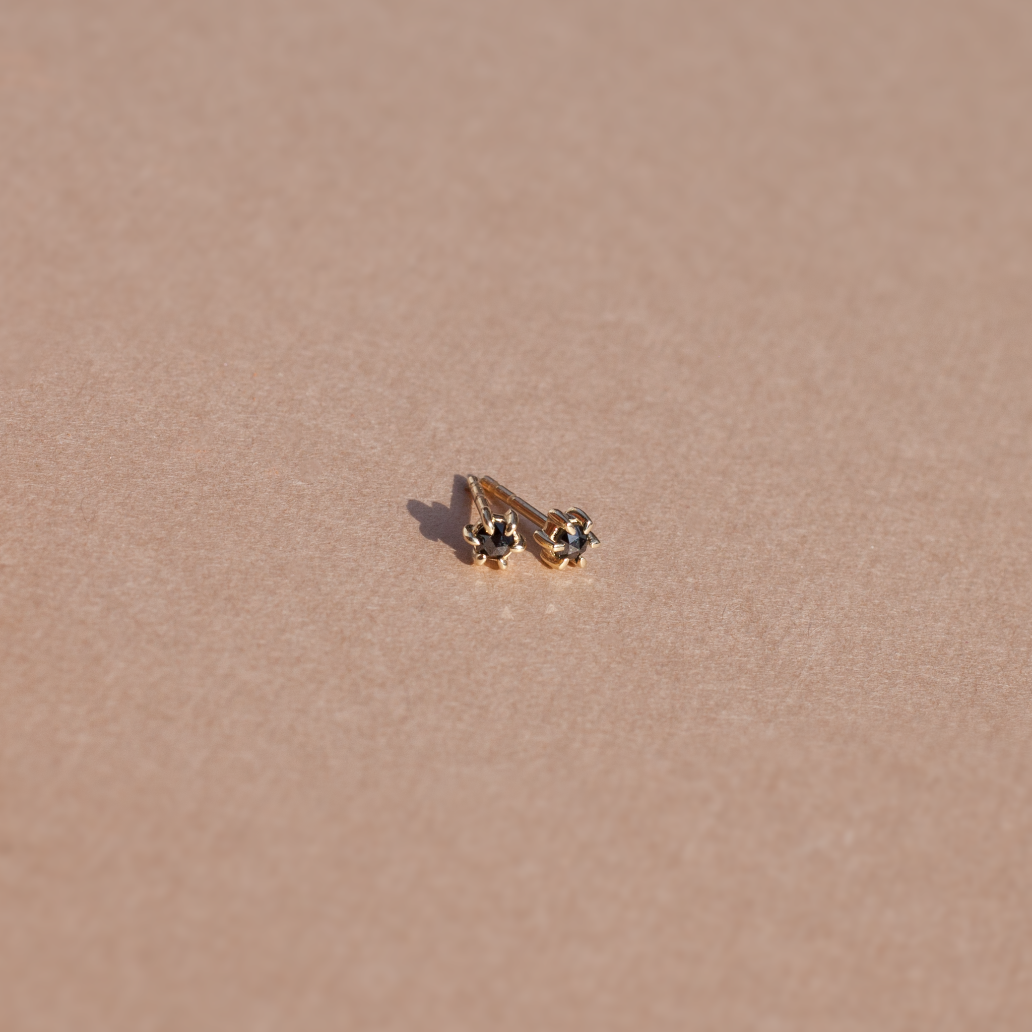 Black diamond stud earrings yellow gold