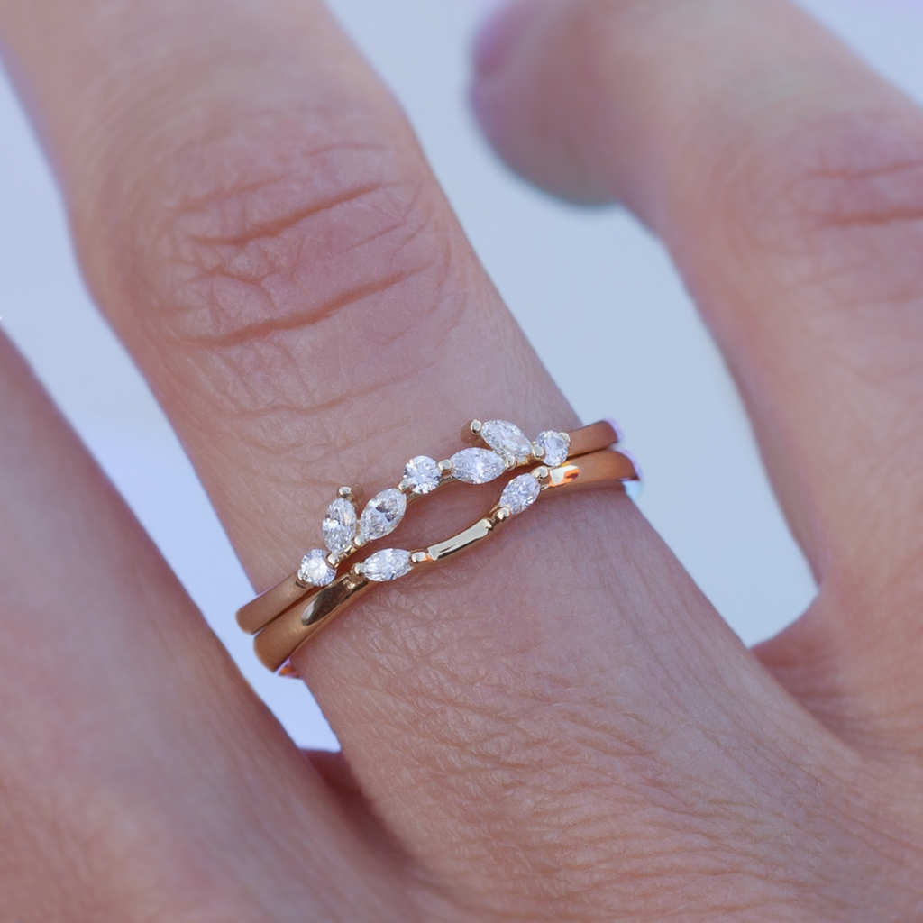 Delicate diamond contour band has a gentle wave design to trace and pair with any engagement ring, whether it’s a solitaire or a halo. This ring is also a perfect everyday stackable ring that can be stacked with your favourite everyday staples, or worn on its own. Made in 14k solid gold.