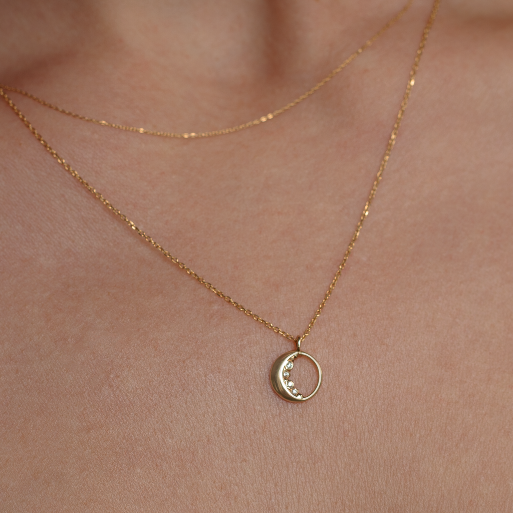 Dainty gold moon charm encrusted with the tiniest of diamonds made in 14K or 18K solid yellow gold.