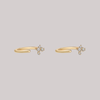 Diamond cluster earring huggie in solid 14k yellow gold.