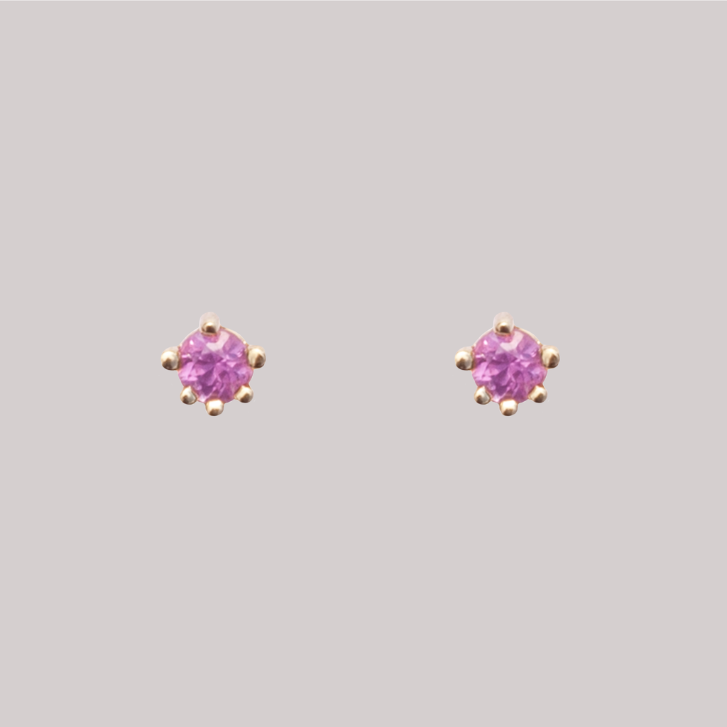 Light pink sapphire earring studs, in a prong setting, made in 14k gold.
