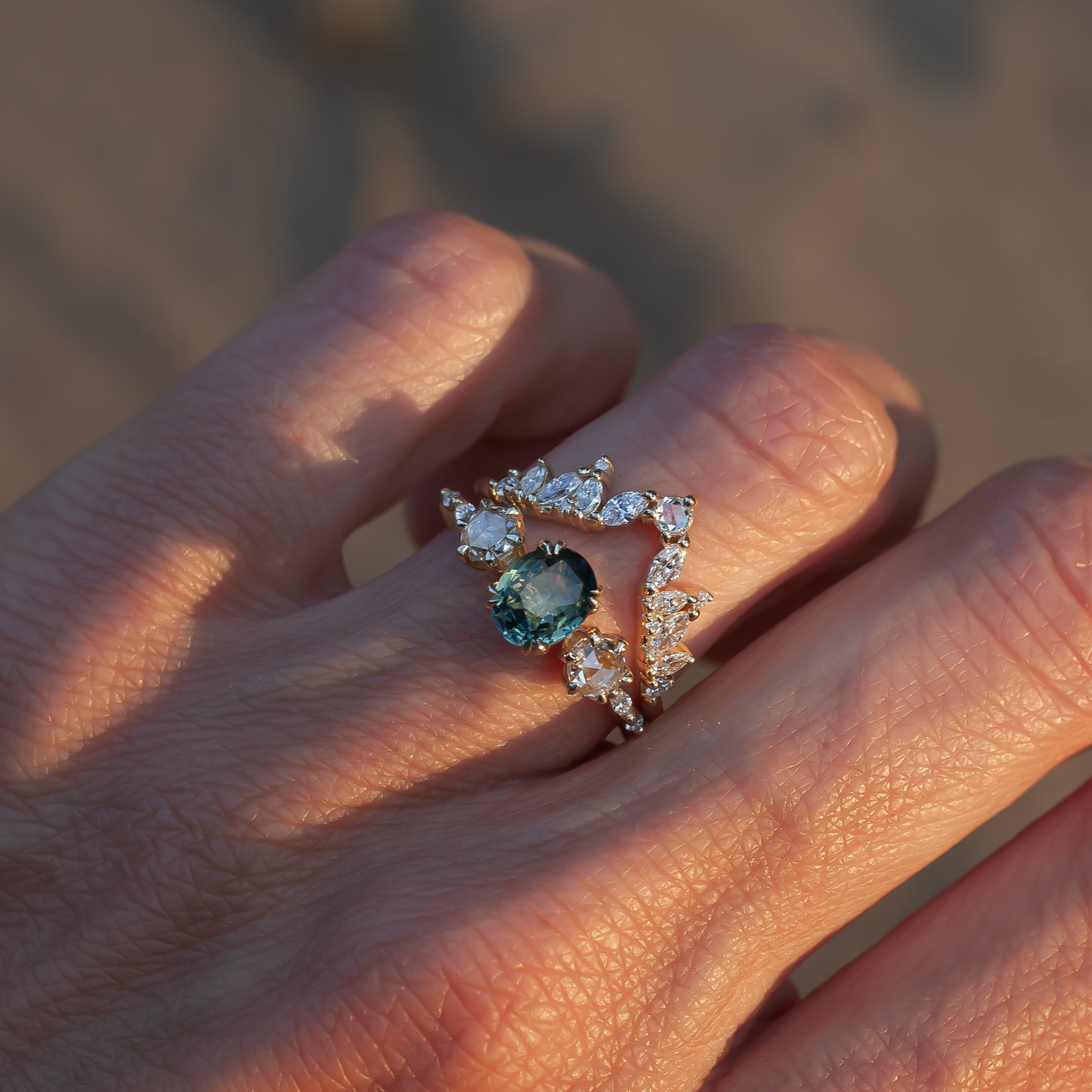 Teal sapphire ring with diamonds