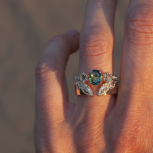 Teal sapphire engagement ring with diamonds
