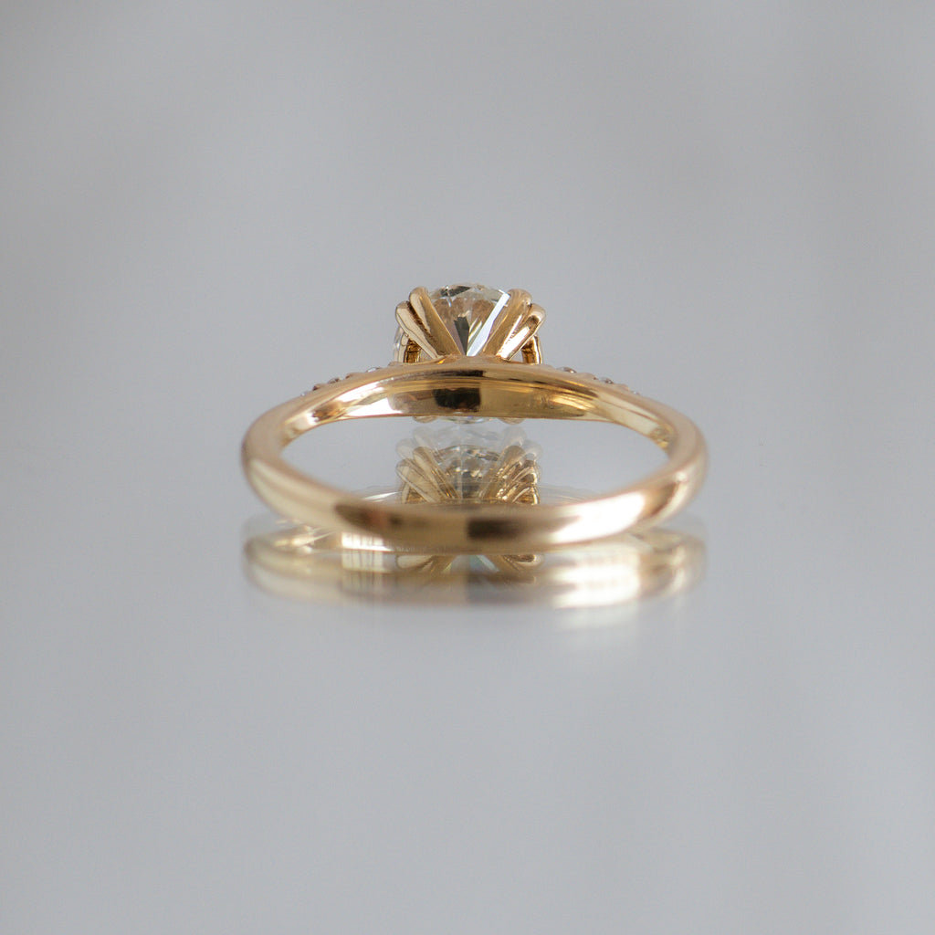 Delicate solitaire diamond engagement ring, set with four double prongs, made in 14k or 18k yellow gold
