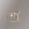 Delicate dangle wedding band, with chevron contour to trace and pair with any engagement ring, whether it’s a solitaire or a halo. This ring is also a perfect everyday stackable ring that can be stacked with your favourite everyday staples, or worn on its own. Made in 14K gold.
