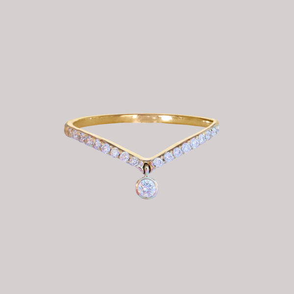 Delicate dangle wedding band, with chevron contour to trace and pair  with any engagement ring, whether it’s a solitaire or a halo. This ring is also a perfect everyday stackable ring that can be stacked with your favourite everyday staples, or worn on its own. Made in 14K gold.