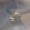 Geometric diamond engagement ring, made with 14k yellow gold and round diamonds.