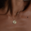 Personalized geometric pendant charm, made with delicate wave detail, encrusted with the tiniest diamonds, featuring a white rose cut diamond, made in 10K yellow gold.