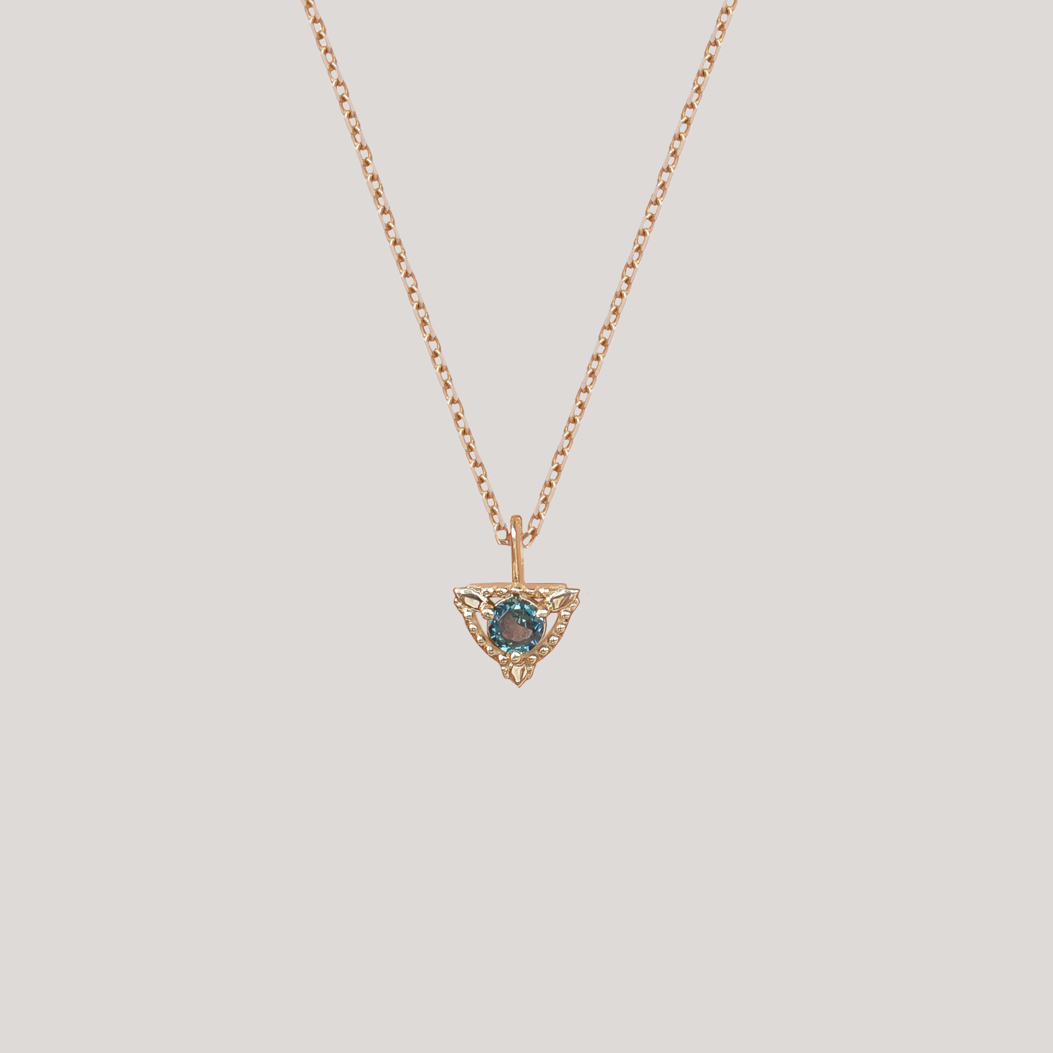Sapphire trillium gold charm