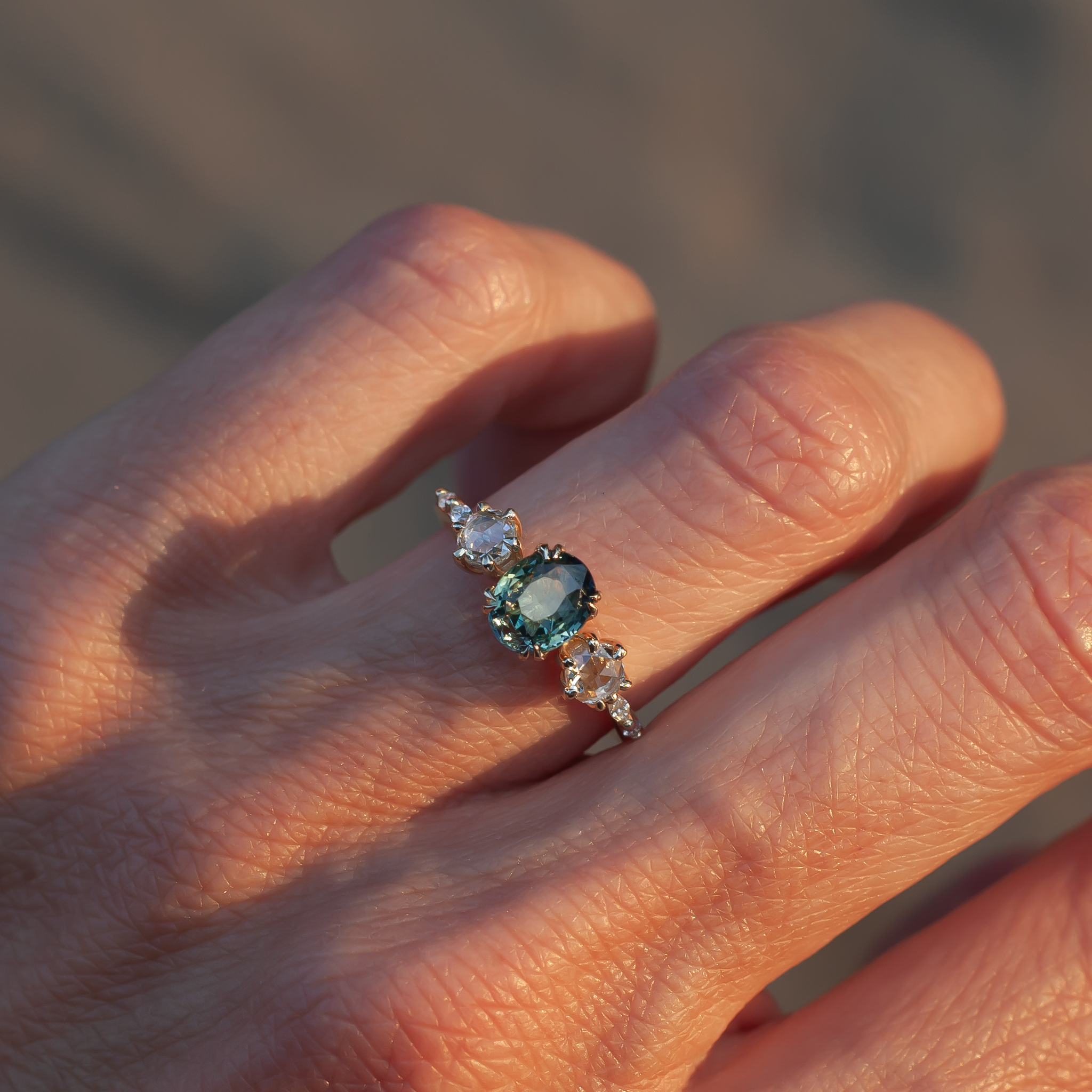 Teal sapphire engagement ring