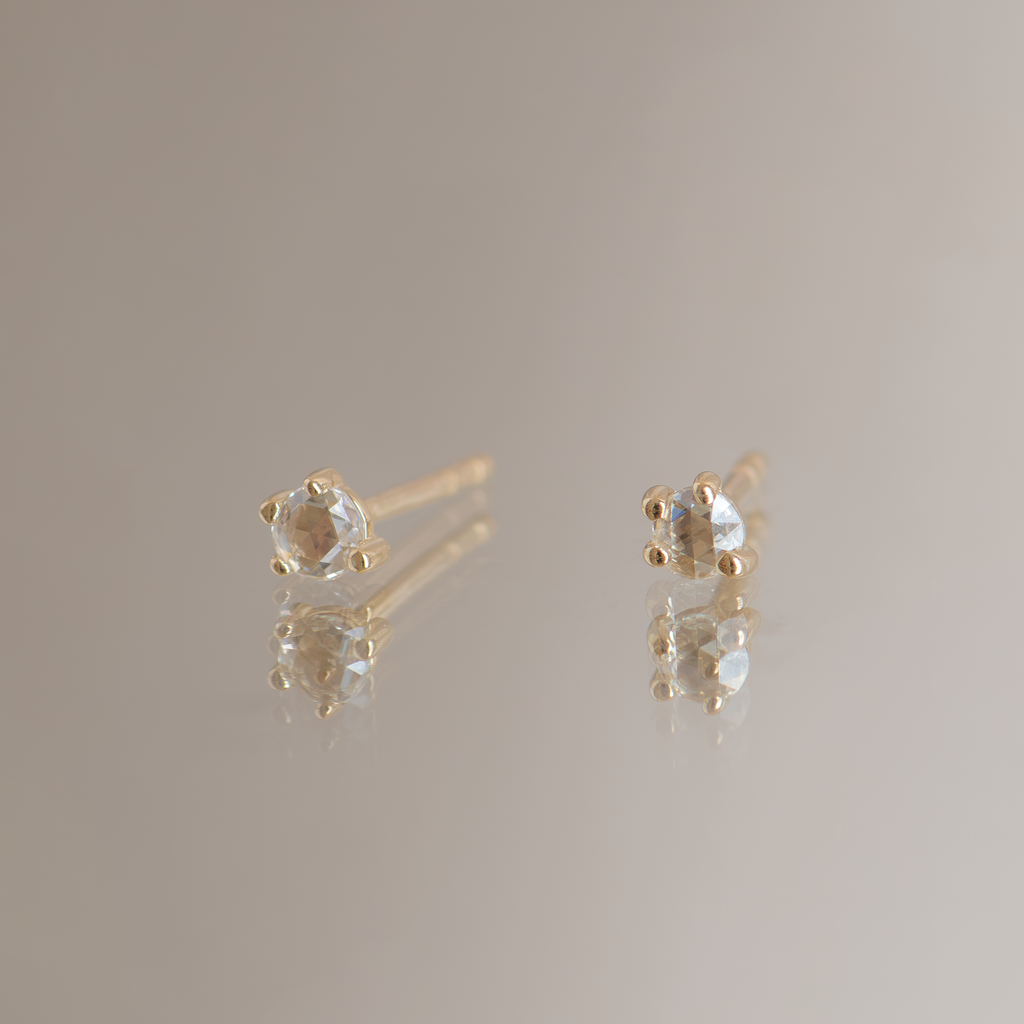 Round rose cut diamond earring studs, in a prong setting, made in 14k yellow gold.