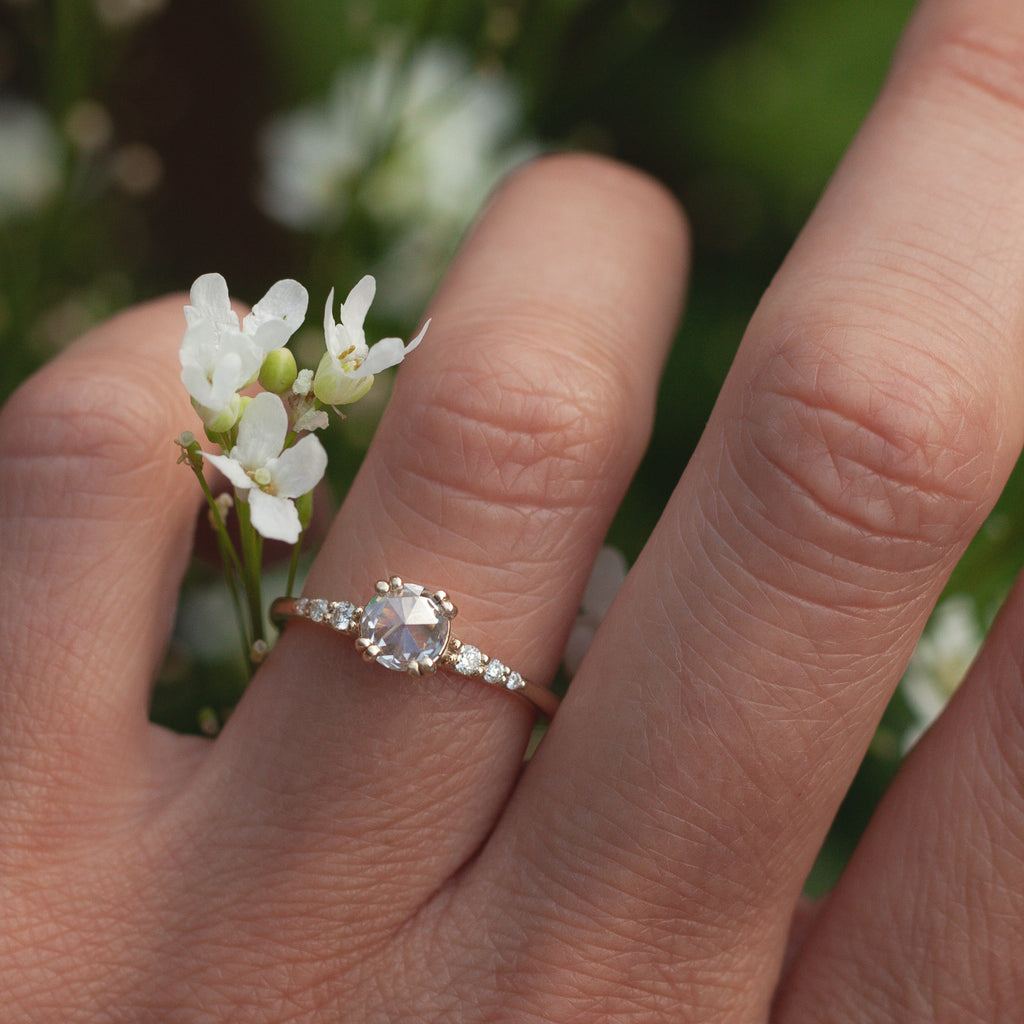 Unique solitaire diamond engagement ring, featuring a round salt and pepper rose cut diamond centre stone, set with four rounded double prongs, made in 14k gold.