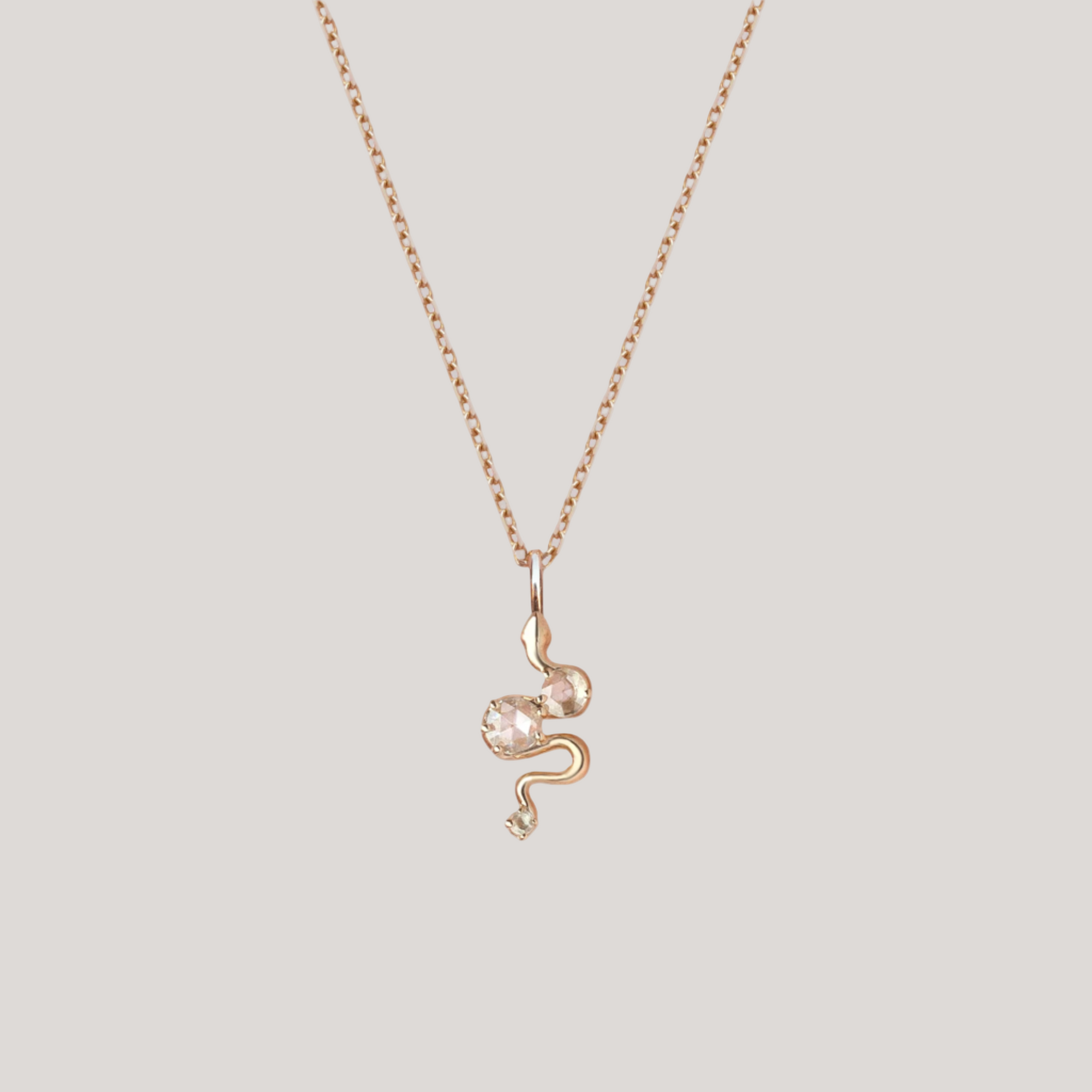 Snake charm yellow gold