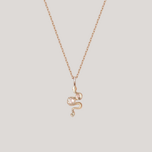Snake charm yellow gold