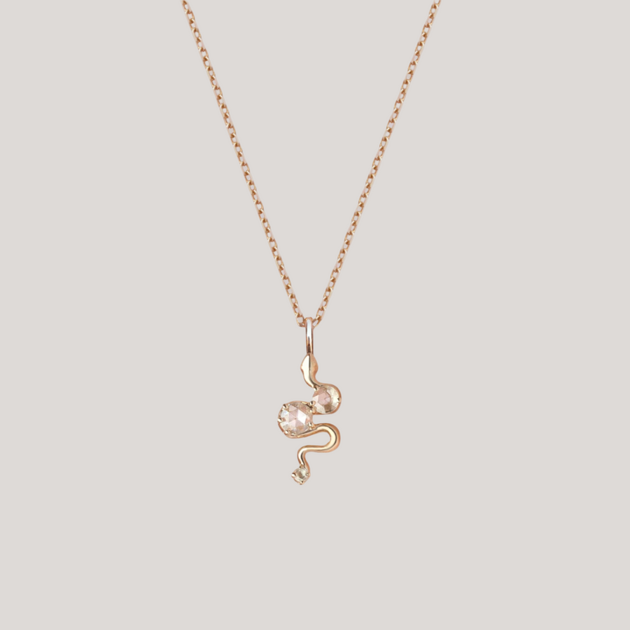 Snake charm yellow gold