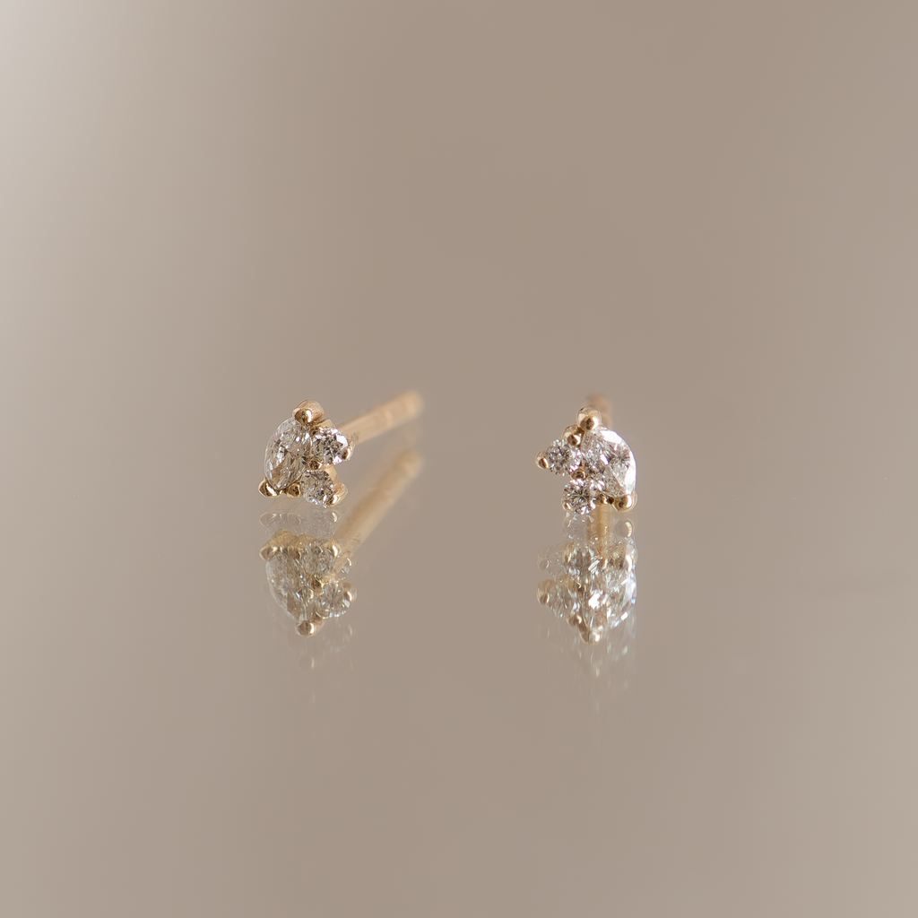 Marquise diamond earring studs, made in 14k gold.