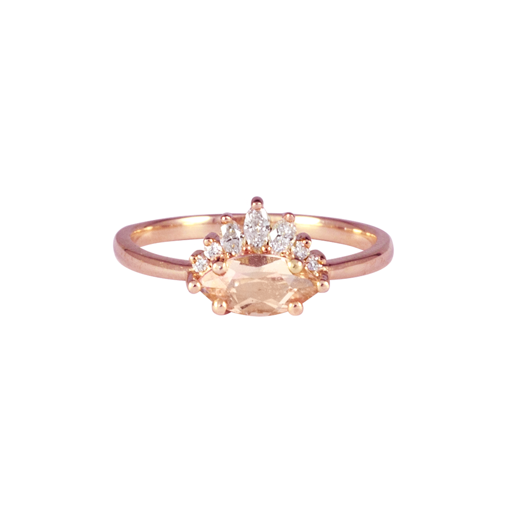 Contemporary take on a traditional marquise engagement ring featuring an East-West marquise Morganite centre stone. The centre stone is surrounded with a diamond crown of marquise and round brilliant diamonds. Made in solid 14k or 18K rose gold.