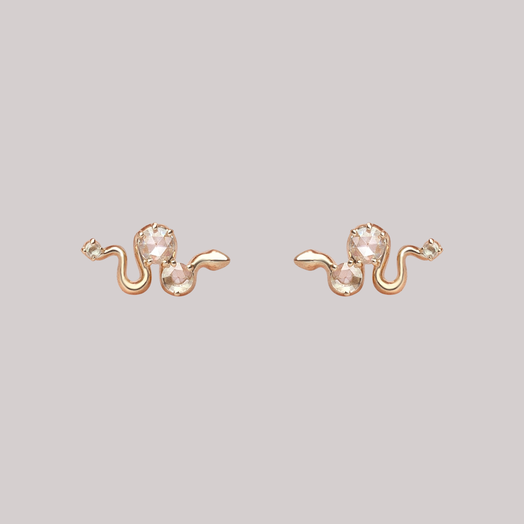 Delicate gold snake earring studs, featuring round rose cut diamonds, made in 14K or 18K yellow, rose or white gold. Perfect studs to layer, mix and match.