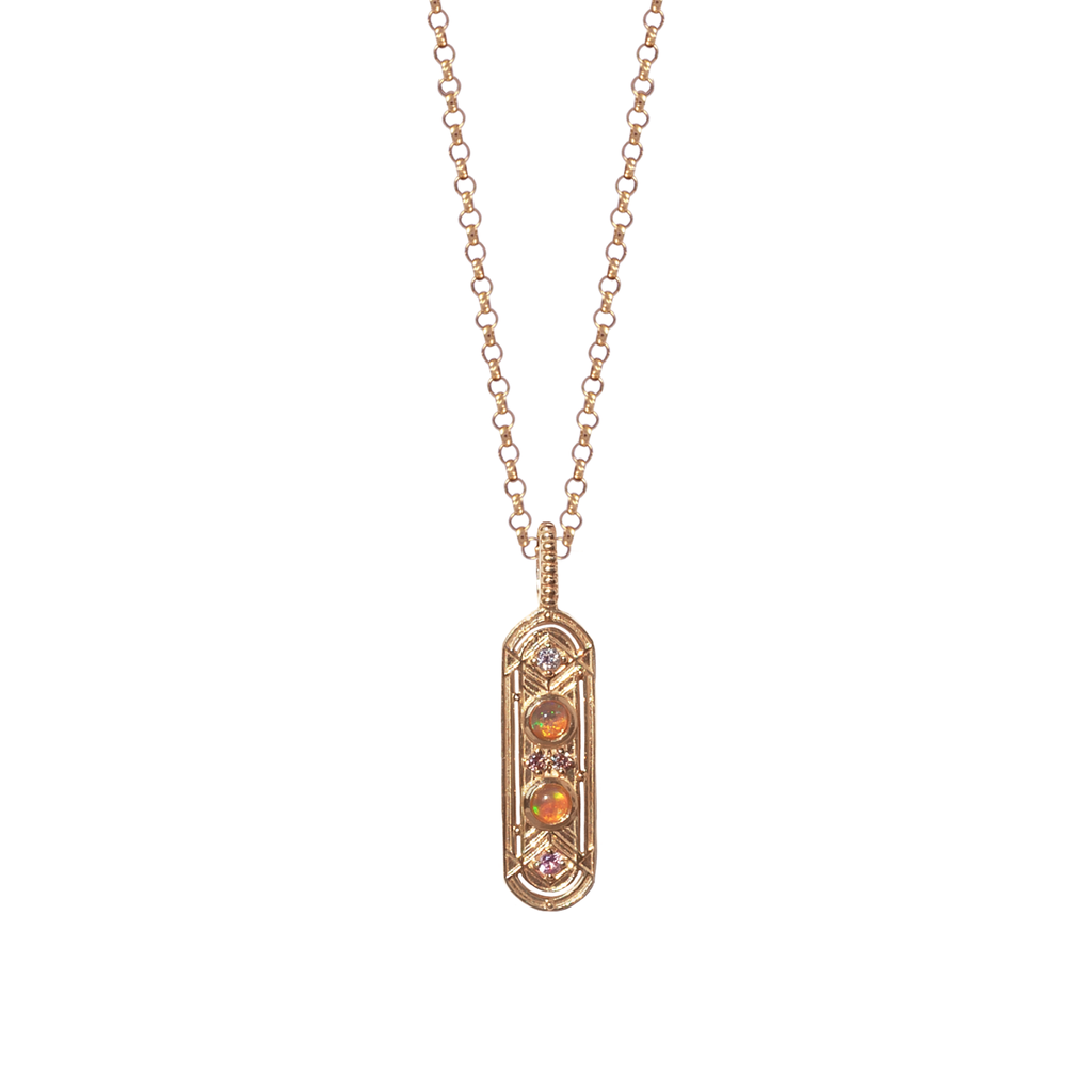 This dainty gold charm, meant to bring balance to your life, featuring two opals and encrusted with the tiniest of diamonds and pink sapphires, made in 14K or 18K gold.