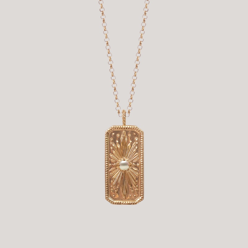 Sunburst gold pearl charm