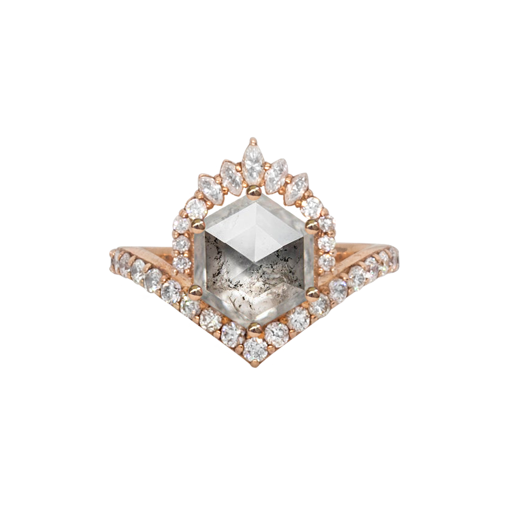 Unique hexagon salt and pepper rose cut diamond engagement ring, featuring a delicate V shape band, encrusted with round brilliant diamonds. The hexagon rose cut diamond has a low profile setting and is surrounded with a fine crown of marquise and round cut white diamonds. Made in 14k or 18k rose gold. 