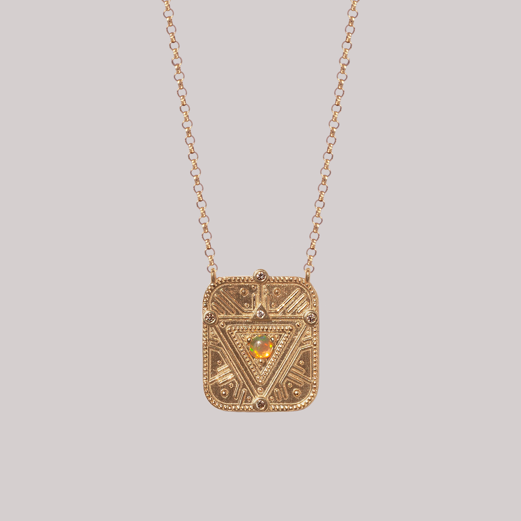 Personalized geometric pendant charm, explosions of light charm, made with geometric triangle detail; sacred light code, encrusted with the tiniest white diamonds, made in 14K or 18K gold.