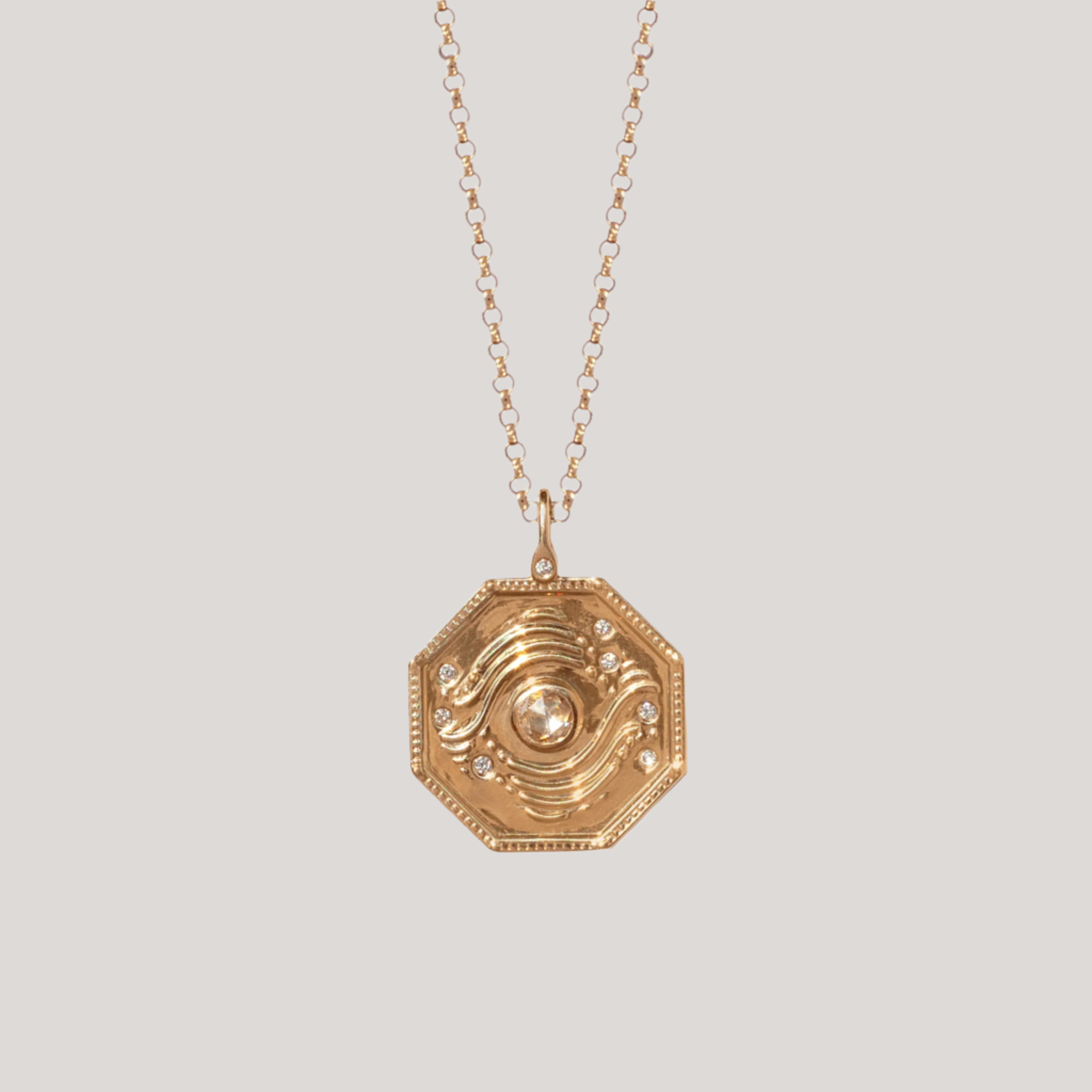 gold talisman charm with diamond