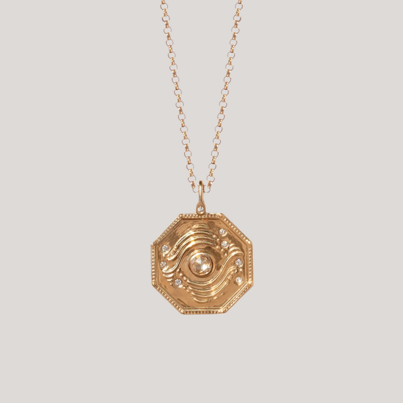 gold talisman charm with diamond
