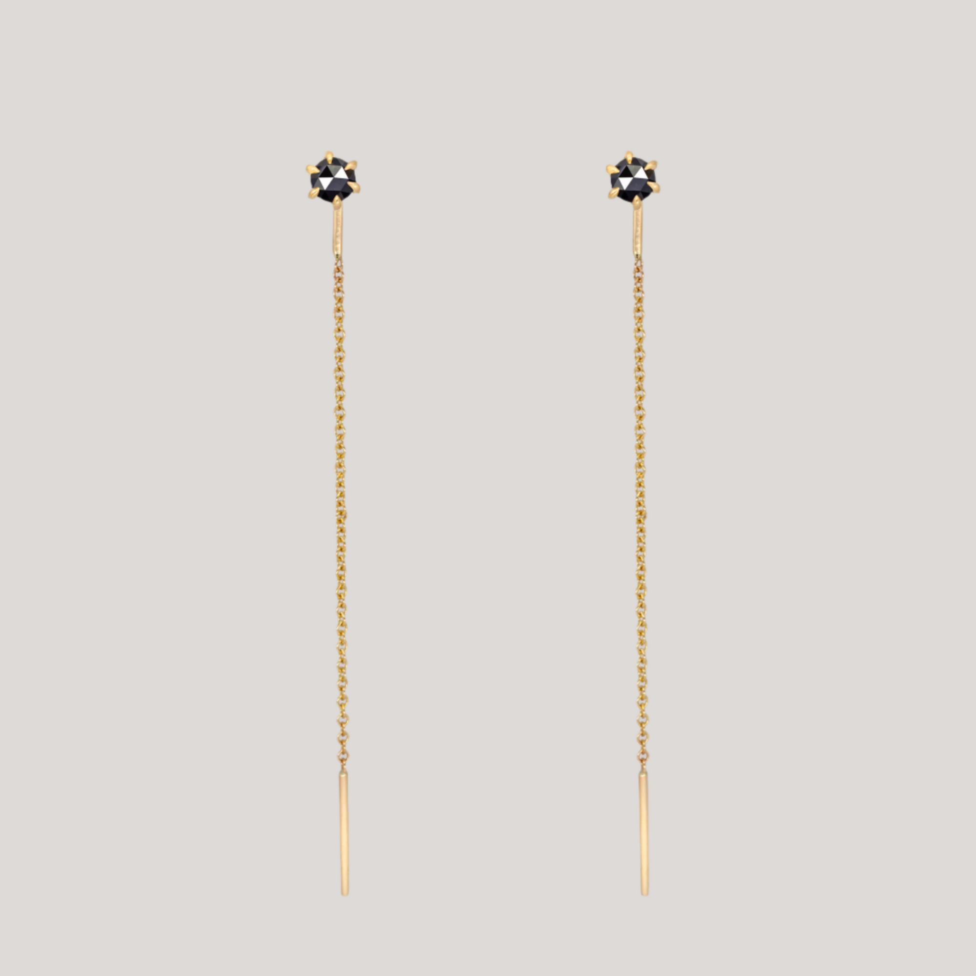 Delicate black round rose cut diamond threaders, ideal for threading through multiple piercings, feature a six claw prong setting, using 14k or 18k gold.