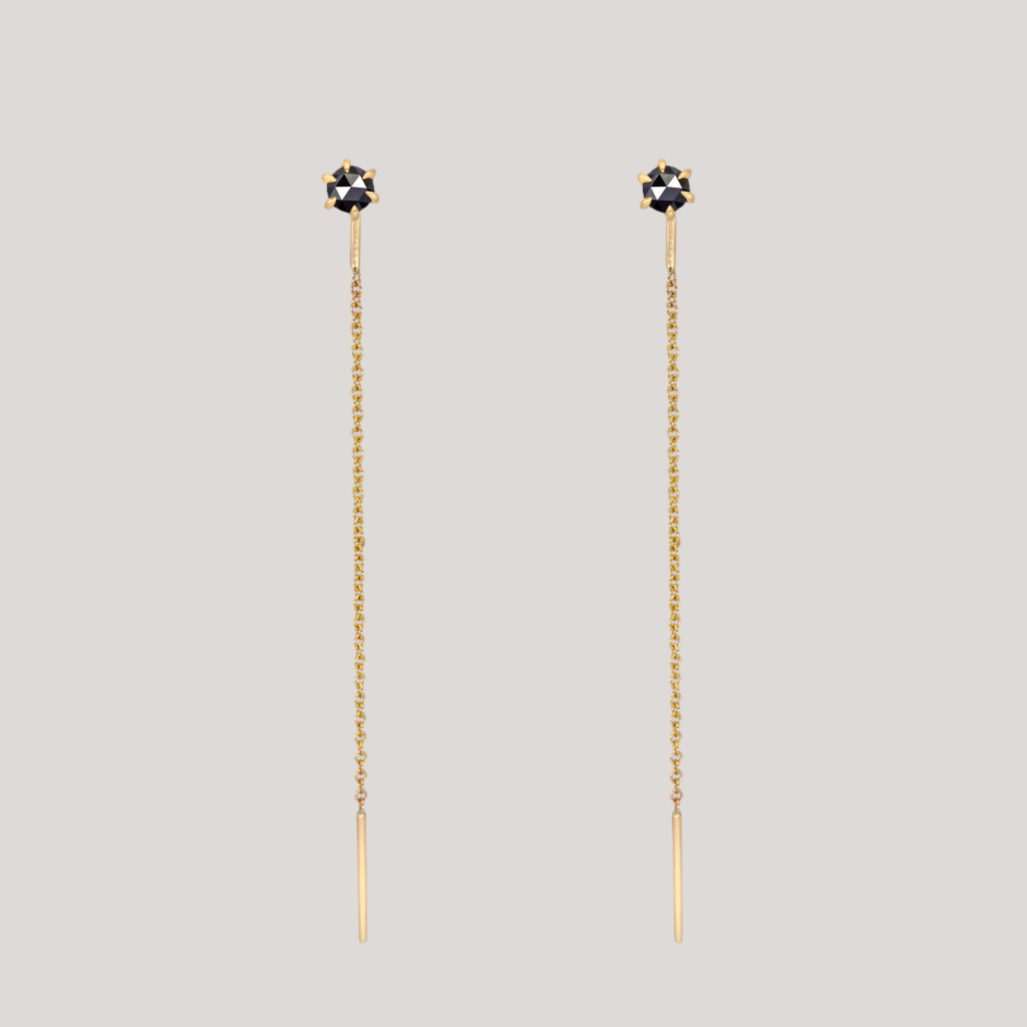 Delicate black round rose cut diamond threaders, ideal for threading through multiple piercings, feature a six claw prong setting, using 14k or 18k gold.