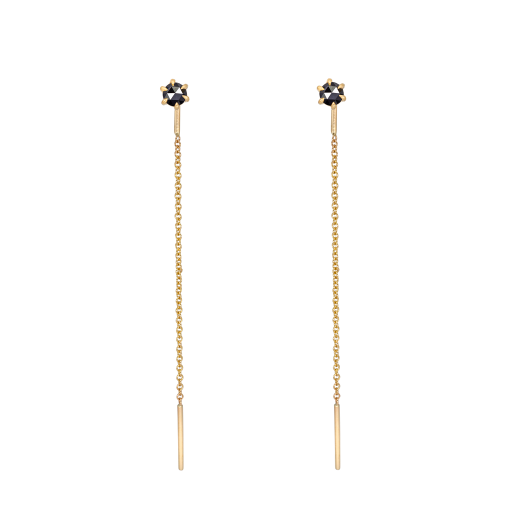 Delicate black round rose cut diamond threaders, ideal for threading through multiple piercings, feature a six claw prong setting, using 14k or 18k yellow gold.
