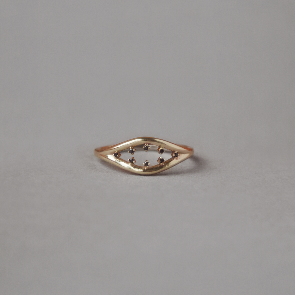 Inspired by the evil eye, split double band everyday gold ring with black diamonds, made in 14k or 18k gold.