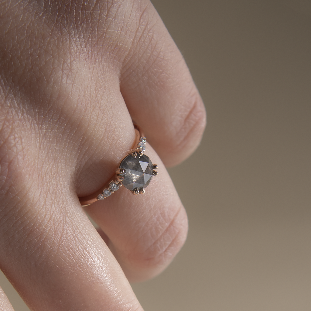 Unique solitaire diamond engagement ring, featuring a round salt and pepper rose cut diamond centre stone, set with four rounded double prongs, made in 14k or 18K gold.