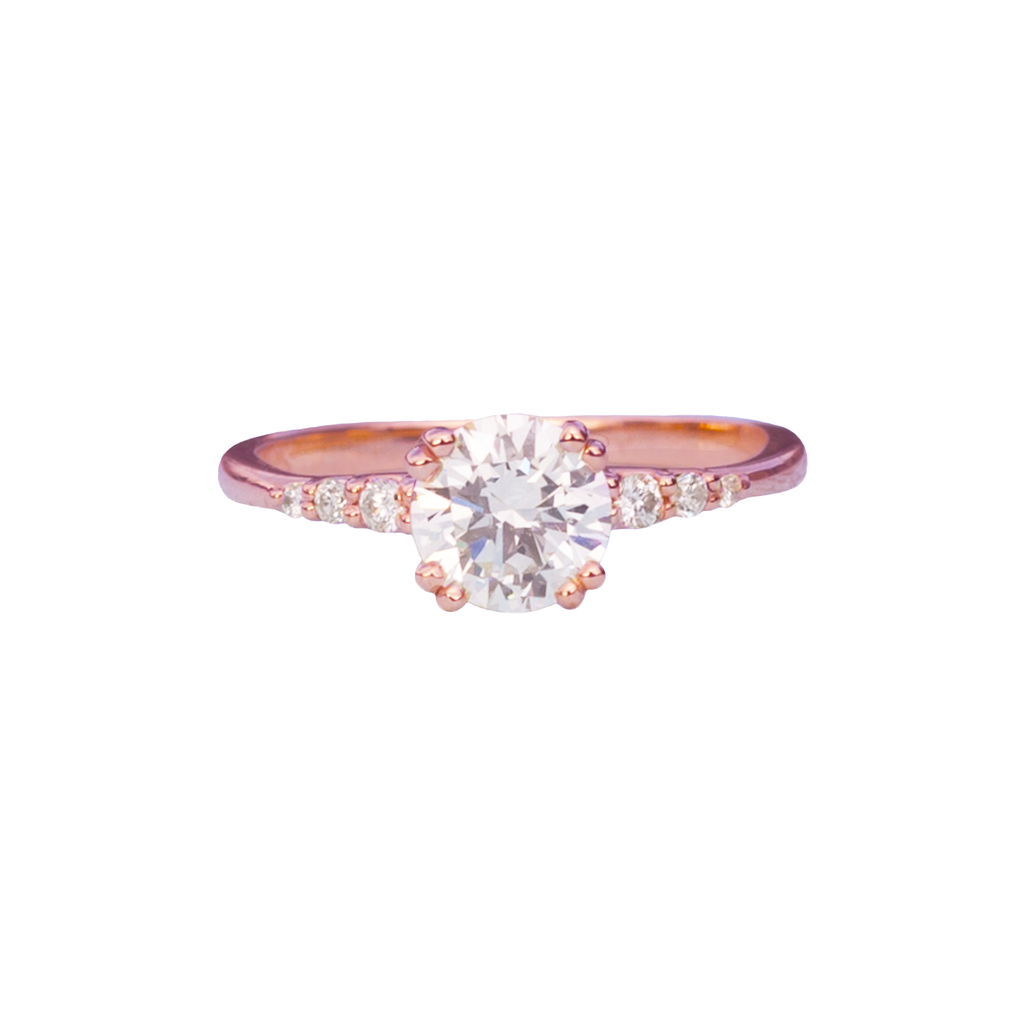 Delicate solitaire diamond engagement ring, set with four double prongs, made in 14k or 18k rose gold.