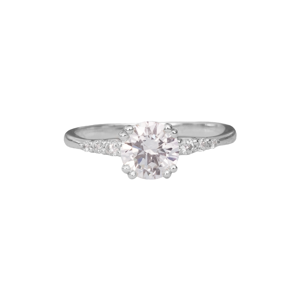 Delicate solitaire diamond engagement ring, set with four double prongs, made in 14k or 18k white gold.