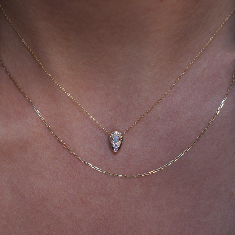 Dainty gold charm with diamonds