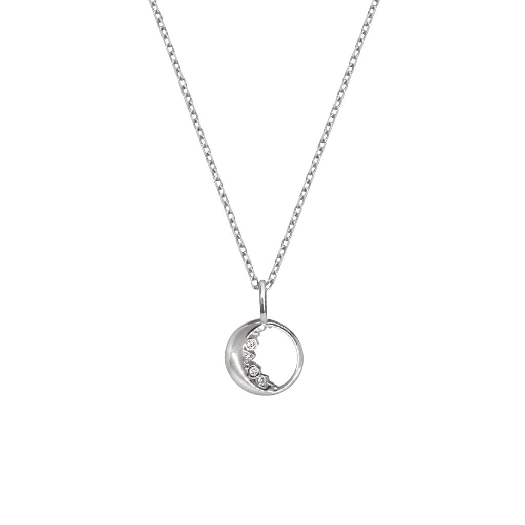 Dainty gold moon charm encrusted with the tiniest of diamonds made in 14K or 18K solid white gold.