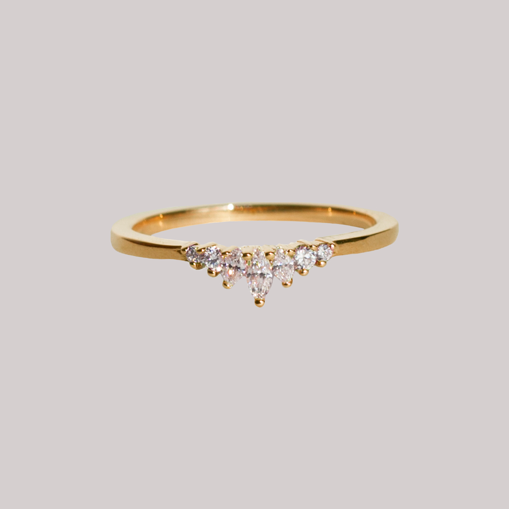 Delicate diamond crown wedding band, with gengle countour, to trace any engagement ring style. Meant to be stacked with an engagement ring or worn on it's own. Made in 14K yellow gold.